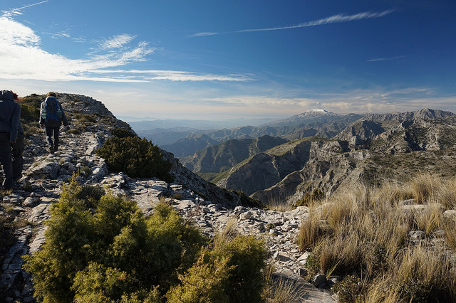 Top of a hike overlooking the mountainous skyline